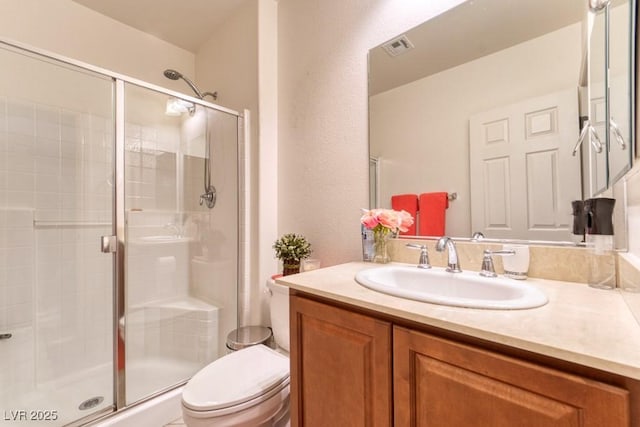 8137 Cape Flattery Ave, Las Vegas, NV 89147 - bathroom with toilet, a stall shower, and vanity
