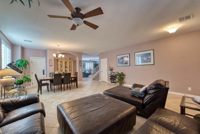 8137 Cape Flattery Ave, Las Vegas, NV 89147 - living room with a ceiling fan, a chandelier, light tile patterned floors, and plenty of natural light