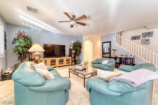 8137 Cape Flattery Ave, Las Vegas, NV 89147 - living room featuring stairs, ceiling fan, and arched walkways