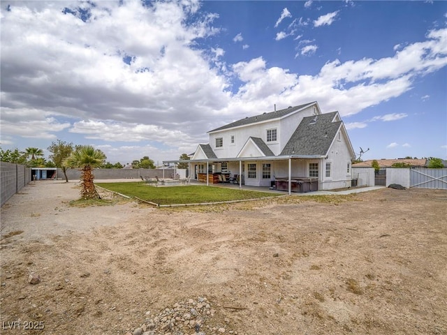 back of house featuring a patio area, a fenced backyard, a gate, a jacuzzi, and french doors