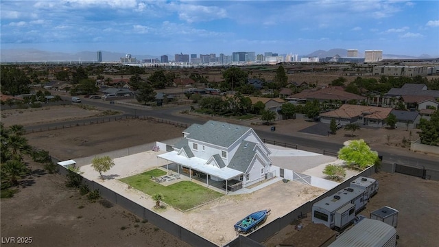 aerial view of property and surrounding area with a skyline view