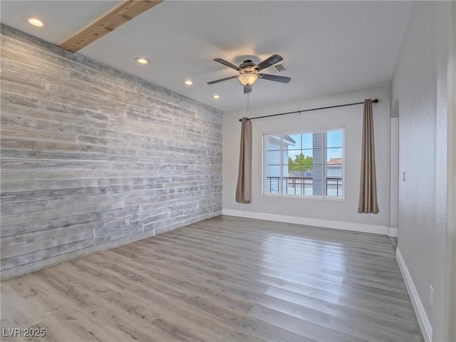 spare room featuring recessed lighting, a ceiling fan, baseboards, and wood finished floors