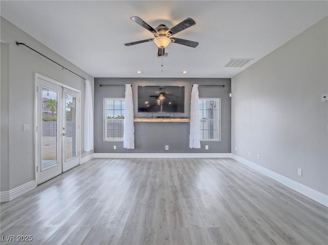 unfurnished living room featuring plenty of natural light, a ceiling fan, baseboards, wood finished floors, and recessed lighting