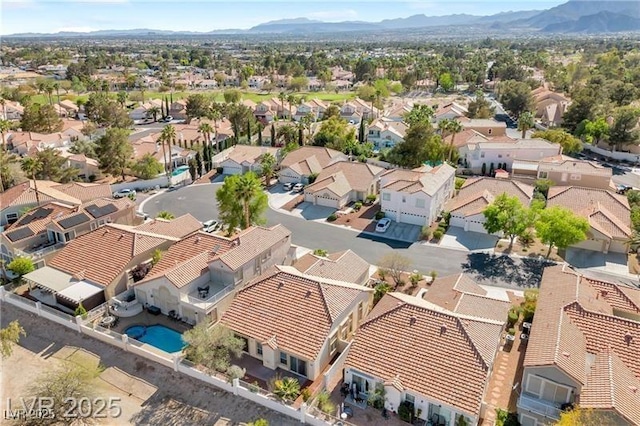 7460 Desert Flame Ct, Las Vegas, NV 89149 - aerial view of residential area with a pool area and a mountainous background