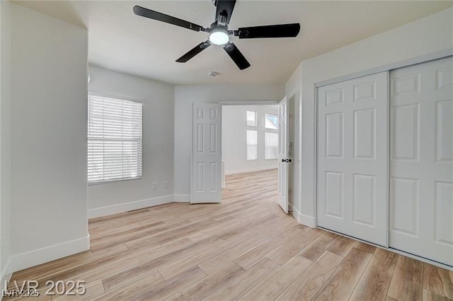 7460 Desert Flame Ct, Las Vegas, NV 89149 - unfurnished bedroom with light wood-type flooring, a closet, baseboards, and ceiling fan