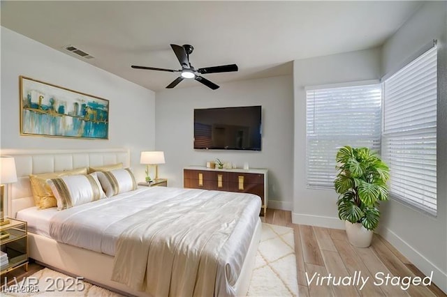 7460 Desert Flame Ct, Las Vegas, NV 89149 - bedroom with light wood-type flooring, baseboards, and a ceiling fan