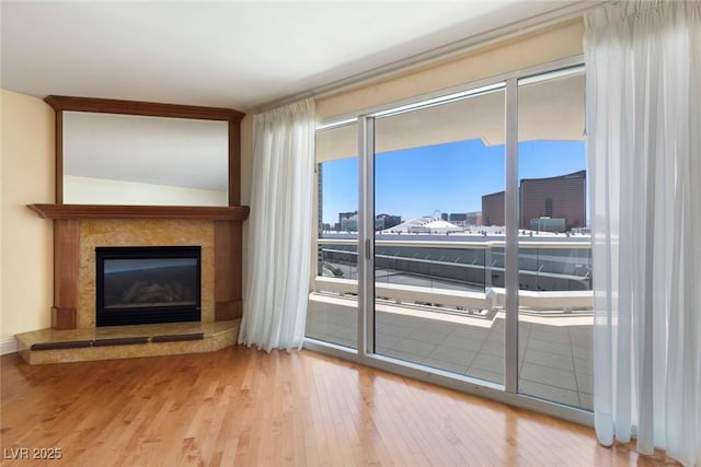 2857 Paradise Rd Unit 802, Las Vegas, NV 89109 - living room with wood finished floors and a premium fireplace