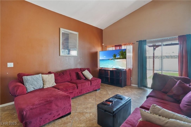 tiled living room featuring high vaulted ceiling and baseboards