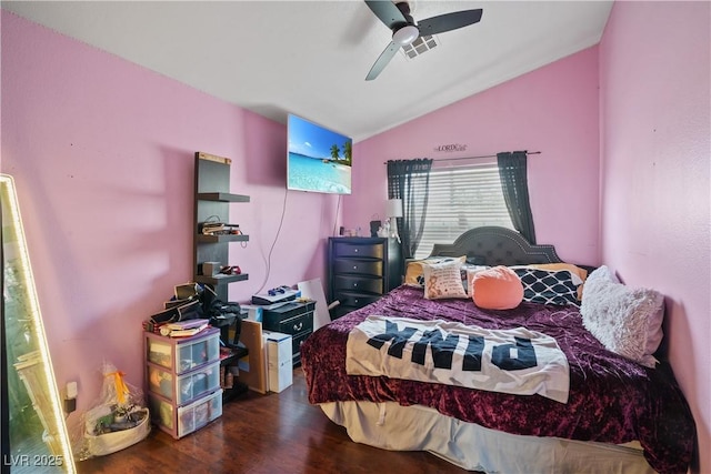 bedroom featuring lofted ceiling, wood finished floors, and ceiling fan