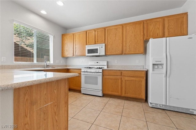 kitchen featuring white appliances, light tile patterned floors, recessed lighting, light stone counters, and a sink