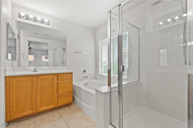 bathroom with a stall shower, tile patterned flooring, vanity, and a ceiling fan