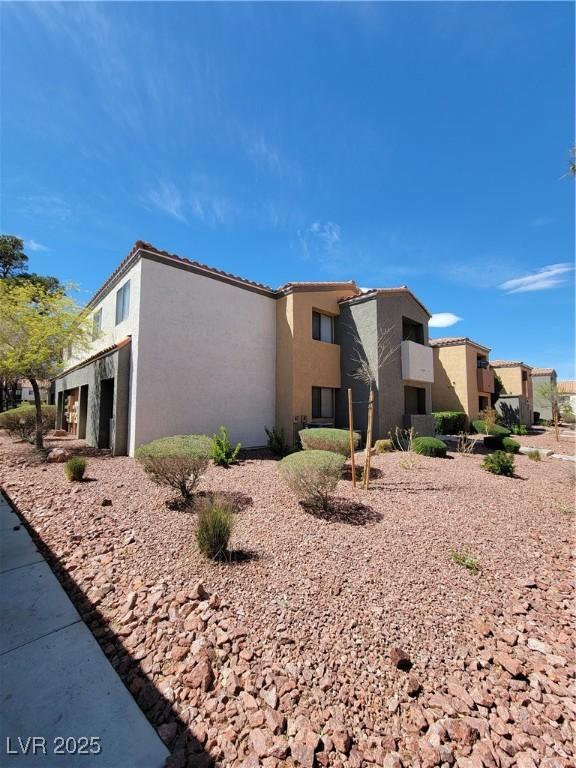 3151 Soaring Gulls Dr Unit 2101, Las Vegas, NV 89128 - view of property exterior with stucco siding