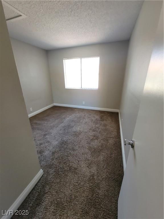 3151 Soaring Gulls Dr Unit 2101, Las Vegas, NV 89128 - carpeted spare room with baseboards and a textured ceiling