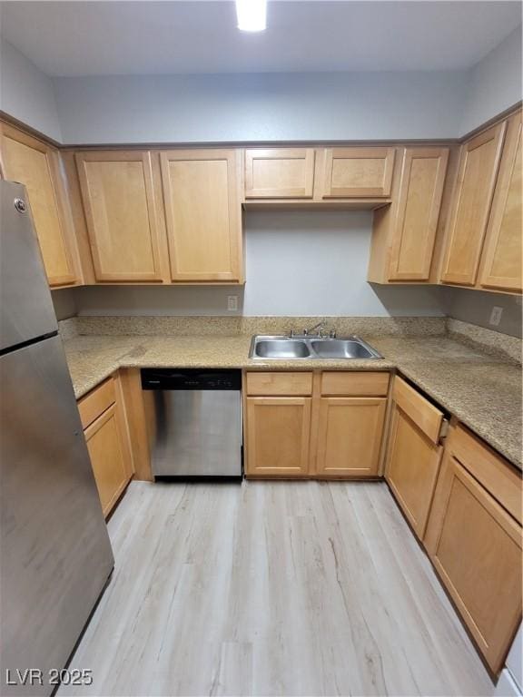 3151 Soaring Gulls Dr Unit 2101, Las Vegas, NV 89128 - kitchen with appliances with stainless steel finishes, a sink, light brown cabinets, light wood finished floors, and light countertops