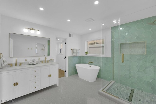 2160 Pueblo Cir, Las Vegas, NV 89169 - full bathroom with a stall shower, a freestanding bath, double vanity, and recessed lighting