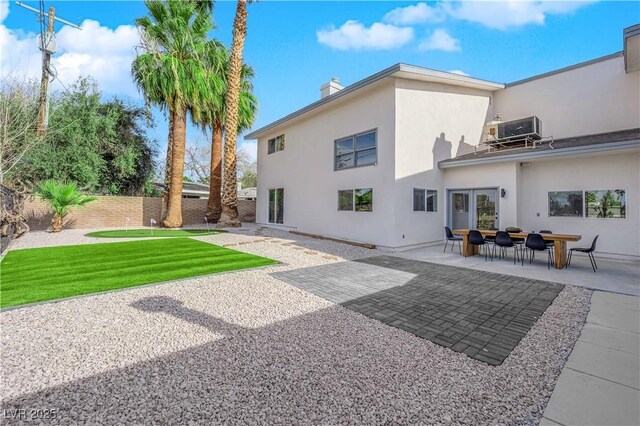 2160 Pueblo Cir, Las Vegas, NV 89169 - back of house with a chimney, central AC, a patio, stucco siding, and fence