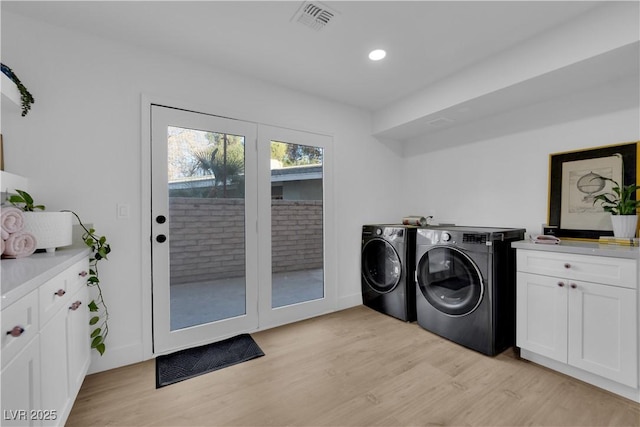 2160 Pueblo Cir, Las Vegas, NV 89169 - laundry area featuring washer and dryer, cabinet space, light wood-type flooring, and recessed lighting