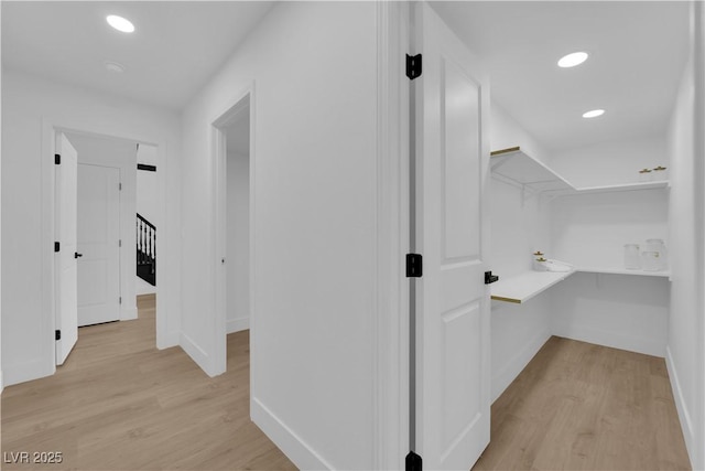 2160 Pueblo Cir, Las Vegas, NV 89169 - hallway with baseboards, light wood-type flooring, and recessed lighting