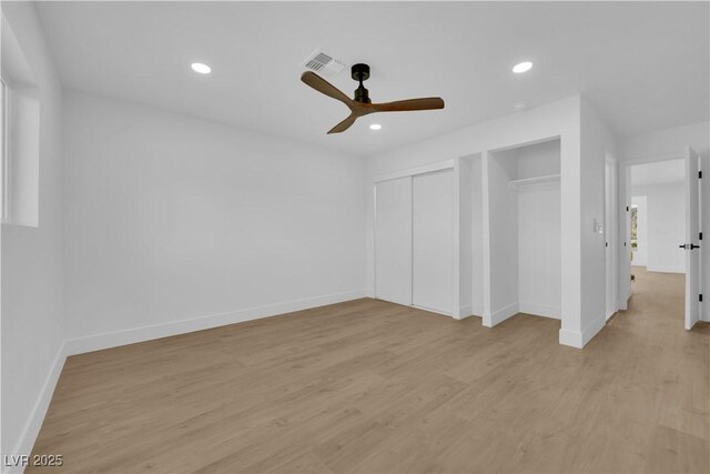 2160 Pueblo Cir, Las Vegas, NV 89169 - unfurnished bedroom featuring multiple closets, light wood finished floors, baseboards, recessed lighting, and a ceiling fan