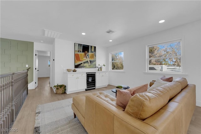 2160 Pueblo Cir, Las Vegas, NV 89169 - living area featuring beverage cooler, light wood-type flooring, recessed lighting, and baseboards