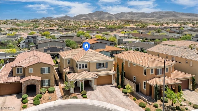 aerial perspective of suburban area featuring a mountainous background