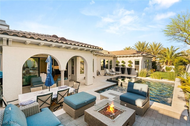 10717 Beringer Dr, Las Vegas, NV 89144 - back of property with a patio area, an outdoor pool, stucco siding, and a tile roof