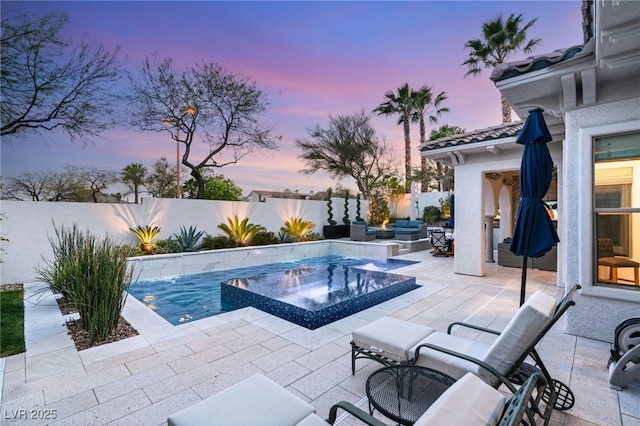10717 Beringer Dr, Las Vegas, NV 89144 - view of pool featuring a patio area, a fenced backyard, a pool with connected hot tub, and an outdoor hangout area