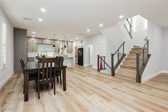 8095 Carpenter Creek Ave, Las Vegas, NV 89113 - dining room with stairway, light wood finished floors, baseboards, and recessed lighting