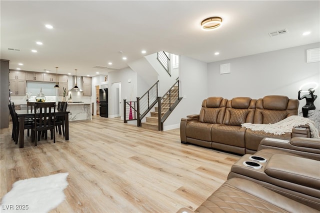 8095 Carpenter Creek Ave, Las Vegas, NV 89113 - living area featuring light wood finished floors, stairway, recessed lighting, and baseboards