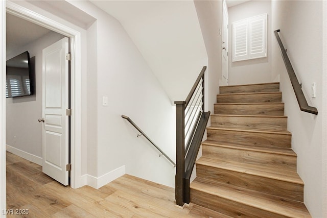 8095 Carpenter Creek Ave, Las Vegas, NV 89113 - stairway featuring wood finished floors and baseboards