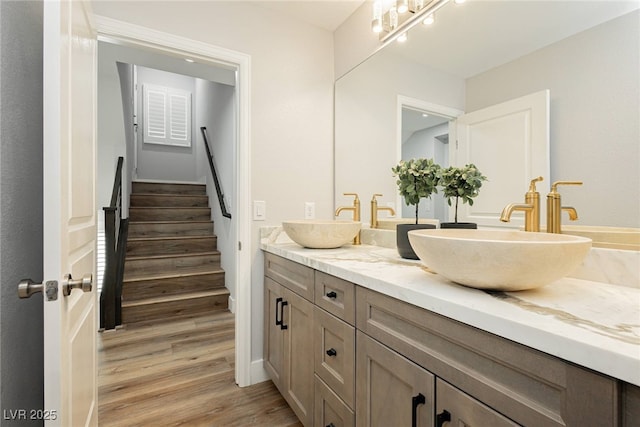 8095 Carpenter Creek Ave, Las Vegas, NV 89113 - full bathroom with wood finished floors, double vanity, and baseboards