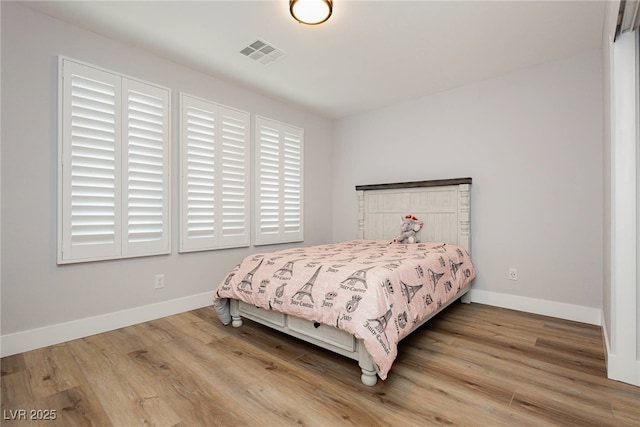 8095 Carpenter Creek Ave, Las Vegas, NV 89113 - bedroom featuring wood finished floors and baseboards