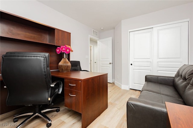 8095 Carpenter Creek Ave, Las Vegas, NV 89113 - office area with light wood-style flooring and baseboards