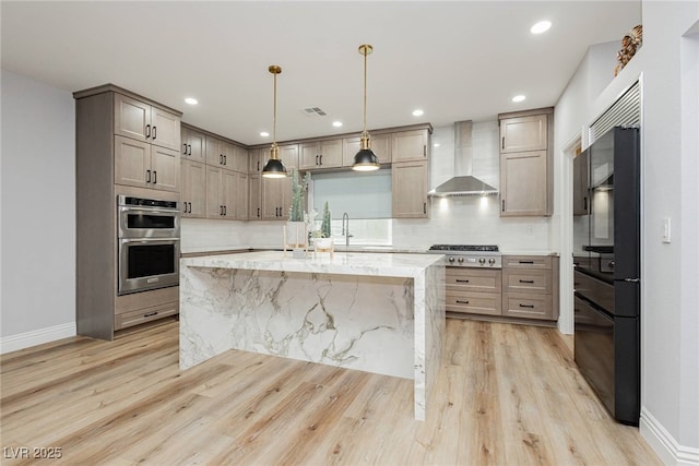 8095 Carpenter Creek Ave, Las Vegas, NV 89113 - kitchen featuring wall chimney range hood, appliances with stainless steel finishes, light wood-style floors, baseboards, and recessed lighting