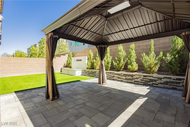8095 Carpenter Creek Ave, Las Vegas, NV 89113 - view of patio featuring a gazebo and a fenced backyard