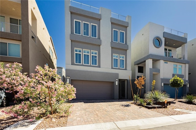 8095 Carpenter Creek Ave, Las Vegas, NV 89113 - view of front of house with a garage, stucco siding, and decorative driveway