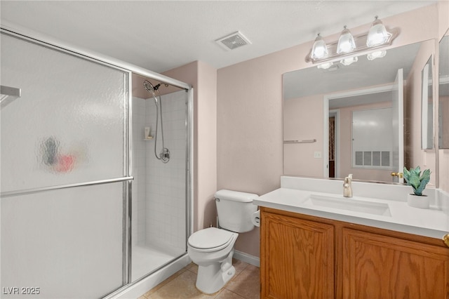 3125 N Buffalo Dr Unit 1103, Las Vegas, NV 89128 - bathroom with toilet, a stall shower, tile patterned floors, and vanity