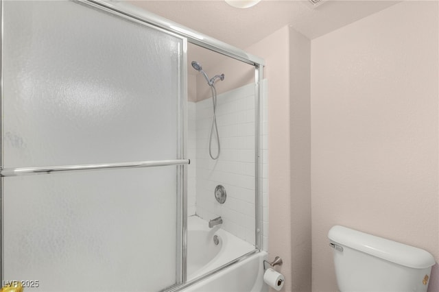 3125 N Buffalo Dr Unit 1103, Las Vegas, NV 89128 - bathroom featuring bath / shower combo with glass door and toilet