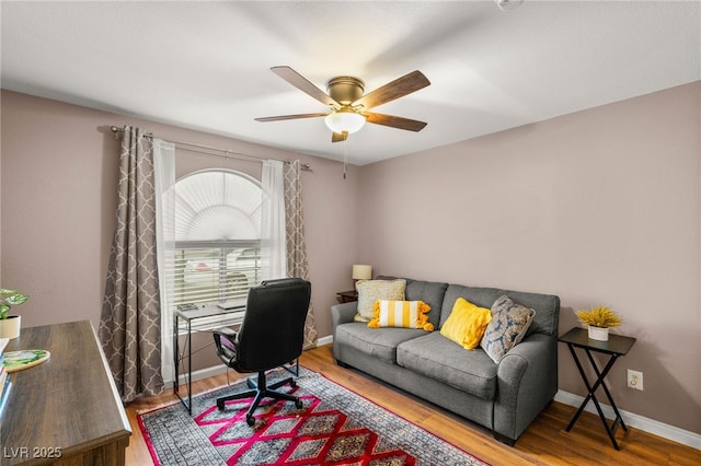 3125 N Buffalo Dr Unit 1103, Las Vegas, NV 89128 - home office featuring a ceiling fan, wood finished floors, and baseboards