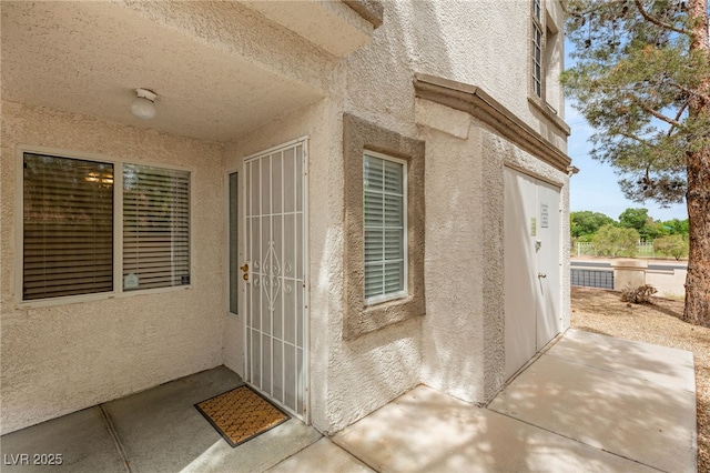 3125 N Buffalo Dr Unit 1103, Las Vegas, NV 89128 - property entrance featuring stucco siding and a patio