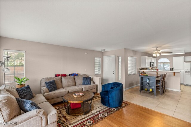 3125 N Buffalo Dr Unit 1103, Las Vegas, NV 89128 - living area with plenty of natural light, baseboards, a ceiling fan, and light tile patterned flooring