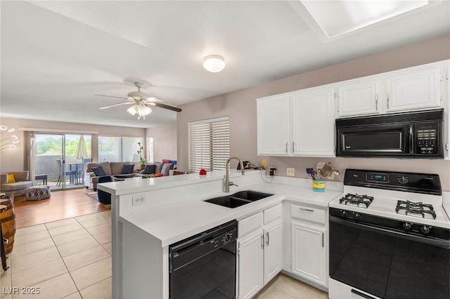 3125 N Buffalo Dr Unit 1103, Las Vegas, NV 89128 - kitchen featuring black appliances, a sink, a peninsula, light countertops, and light tile patterned floors