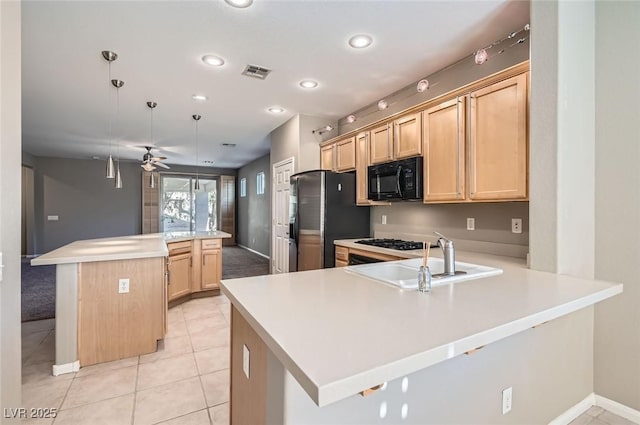 kitchen with black appliances, a sink, light brown cabinets, ceiling fan, and a peninsula