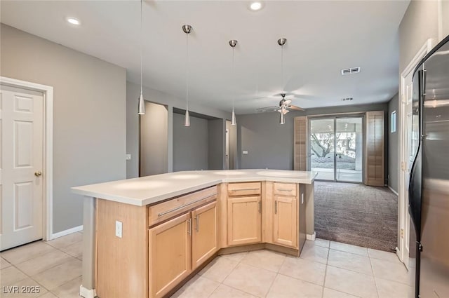 kitchen with light brown cabinets, light tile patterned floors, a kitchen island, ceiling fan, and recessed lighting