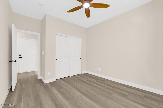 177 Rocky Star St, Henderson, NV 89012 - unfurnished bedroom with wood finished floors, baseboards, a closet, and ceiling fan