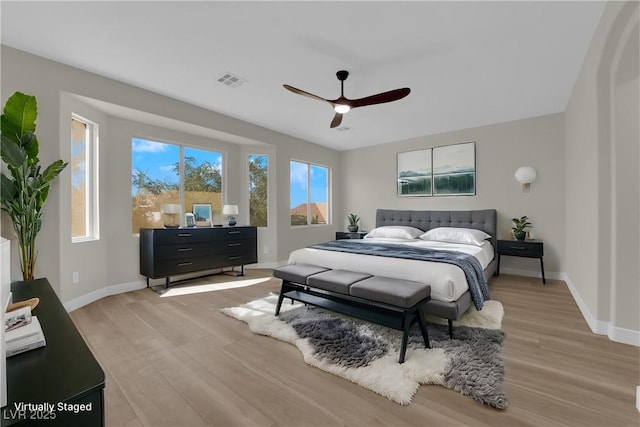 177 Rocky Star St, Henderson, NV 89012 - bedroom with light wood-type flooring, baseboards, and ceiling fan