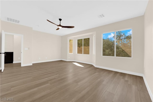 177 Rocky Star St, Henderson, NV 89012 - empty room featuring a ceiling fan, wood finished floors, and baseboards