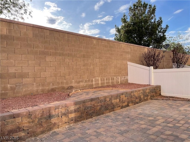 view of yard featuring fence and a patio area
