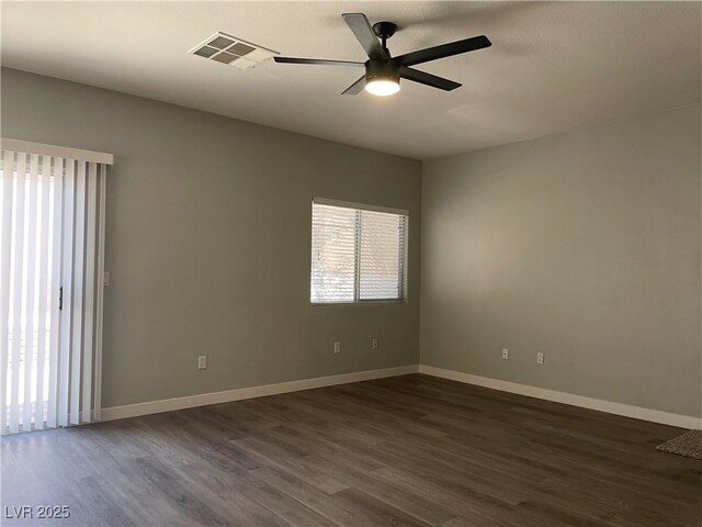 9333 Leaping Deer Pl Unit 103, Las Vegas, NV 89178 - empty room featuring dark wood-style flooring, ceiling fan, and baseboards