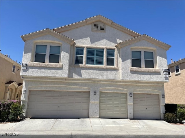 9333 Leaping Deer Pl Unit 103, Las Vegas, NV 89178 - multi unit property featuring an attached garage, stucco siding, and driveway